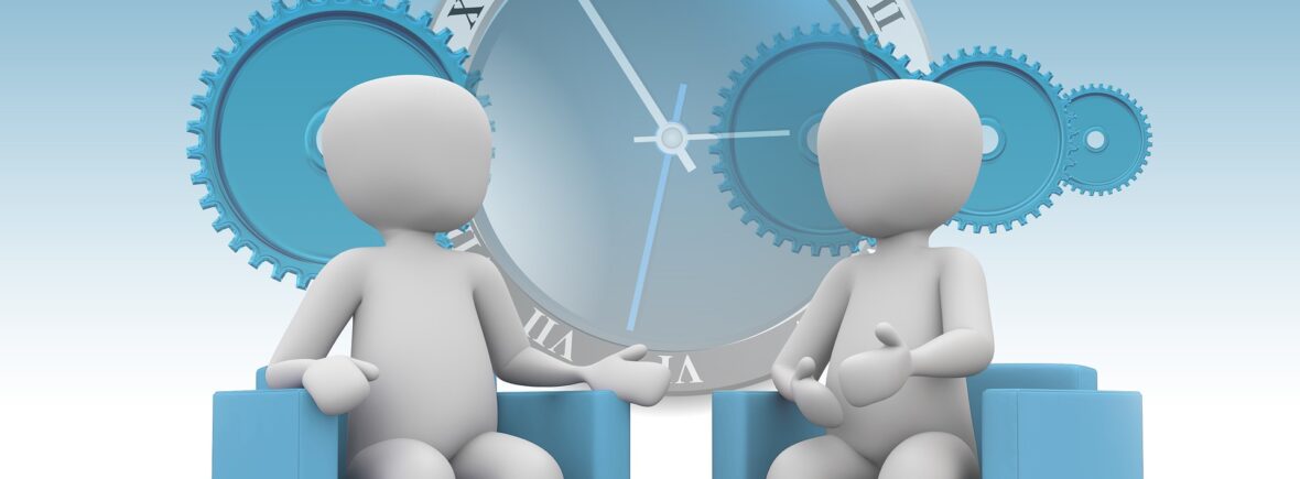 People meeting with clock behind them