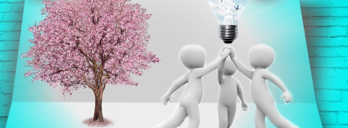 3 individuals holding lightbulb together